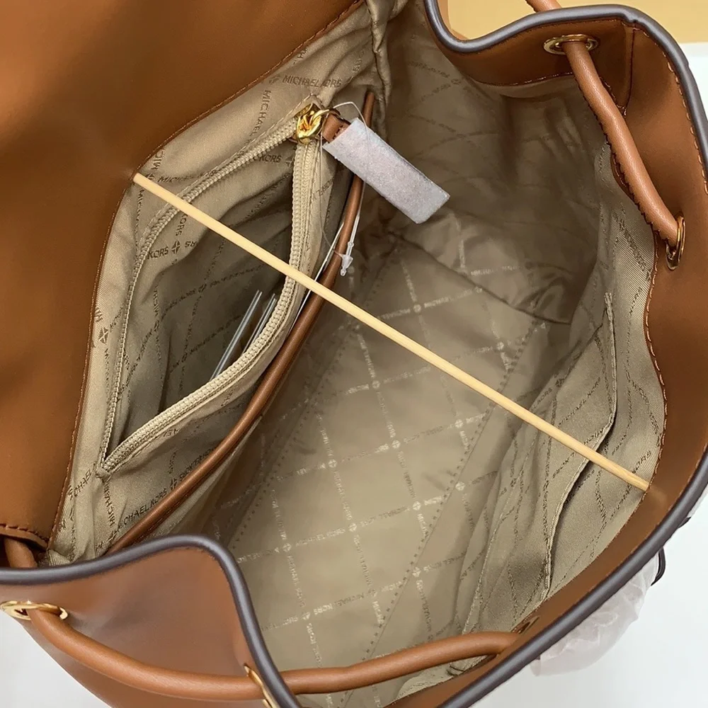 MICHAEL KORS PHOEBE MEDIUM DRAWSTRING BACKPACK VANILLA/ BROWN SIGNATURE COLOR